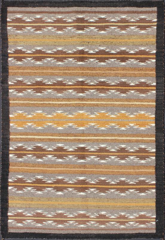Earthy Tones USA Navajo Kilim rug with Black Border Tribal Design 1940s Navajo Tribal Kilim with geometric design in Marigold, grey and black rug M14 - 0902, country of origin / type: America / Navajo, circa 1940 This intriguing antique Nav... - Keivan Woven ArtsM14 - 0902 - 5930Rug