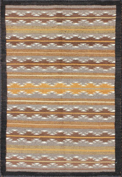 Earthy Tones USA Navajo Kilim rug with Black Border Tribal Design 1940s Navajo Tribal Kilim with geometric design in Marigold, grey and black rug M14 - 0902, country of origin / type: America / Navajo, circa 1940 This intriguing antique Nav... - Keivan Woven ArtsM14 - 0902 - 5930Rug