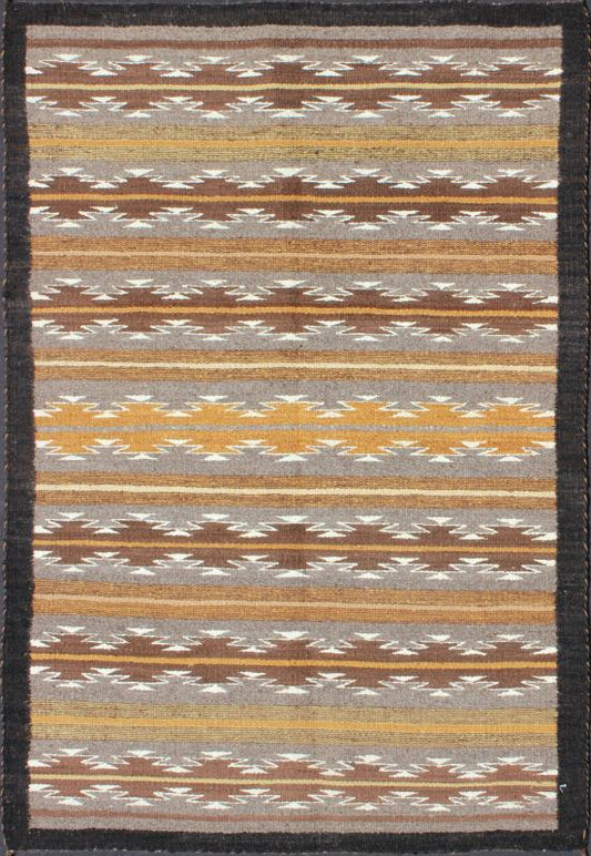 Earthy Tones USA Navajo Kilim rug with Black Border Tribal Design 1940s Navajo Tribal Kilim with geometric design in Marigold, grey and black rug M14 - 0902, country of origin / type: America / Navajo, circa 1940 This intriguing antique Nav... - Keivan Woven ArtsM14 - 0902 - 5930Rug