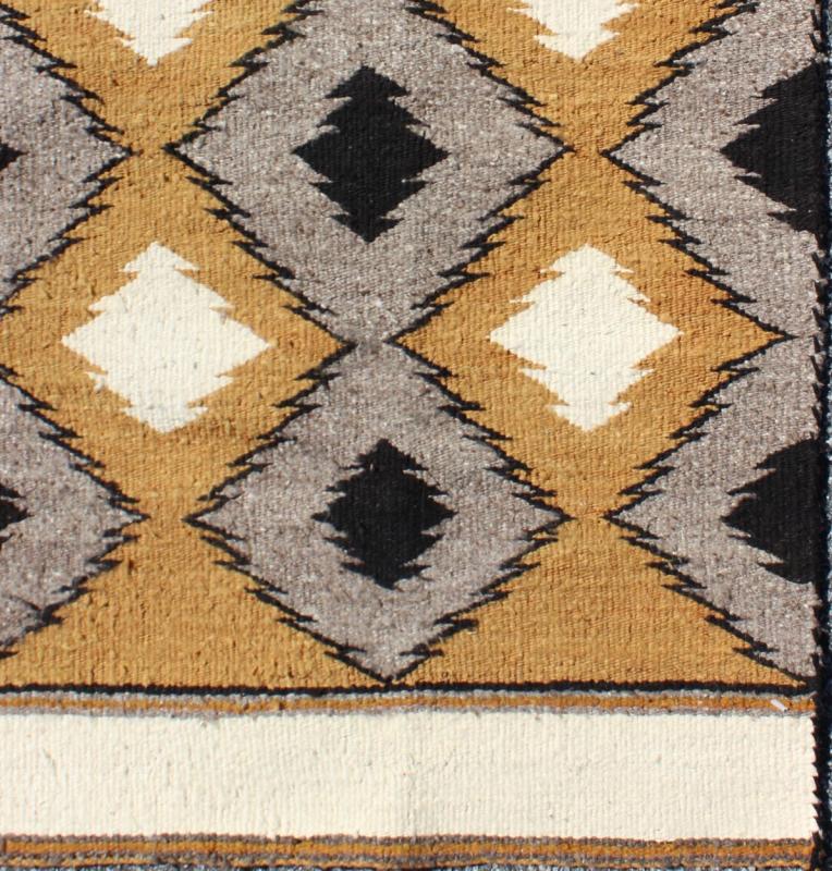 Allover Tribal Navajo Kilim with Gold, Gray and Black 1940s American Navajo Kilim with geometric design in Marigold, black and grey kilim M14 - 0903, country of origin / type: America / Navajo, circa 1940 This intriguing antique Navajo Kili... - Keivan Woven ArtsM14 - 0903 - 5934Rug