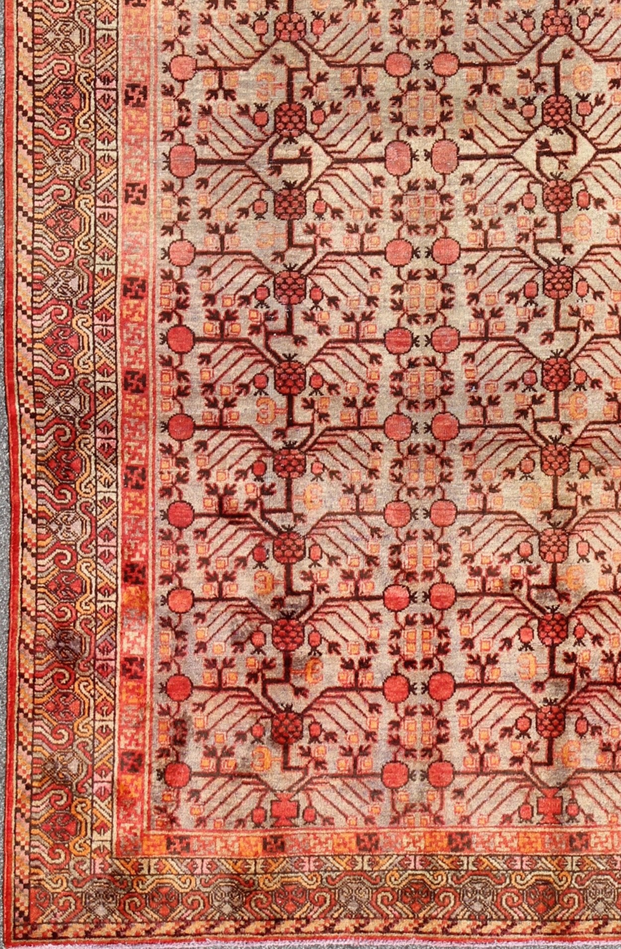 Antique Khotan Rug This attractive antique Khotan rug is a spectacular testament to the complexity of Turkestan design. The neutral tone of the central field plays host to a stunning display of the entwined tree of life bearing budding blossoms ... - Keivan Woven ArtsMP - 1301 - 339 - 3984Rug