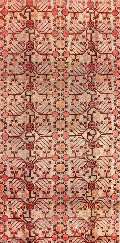 Antique Khotan Rug This attractive antique Khotan rug is a spectacular testament to the complexity of Turkestan design. The neutral tone of the central field plays host to a stunning display of the entwined tree of life bearing budding blossoms ... - Keivan Woven ArtsMP - 1301 - 339 - 3984Rug