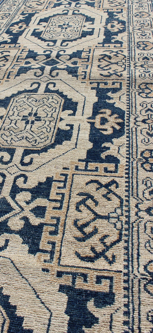 Vintage Khotan Rug with Geometric Medallions in Navy and Cream Tones Khotan with Geometric Medallions, rug MP - 1310 - 93, country of origin / type: Afghanistan / Khotan, circa Early - 21st Century. Measures: 2'11 x 10'3. This Khotan fe... - Keivan Woven ArtsMP - 1310 - 93 - 4758Rug