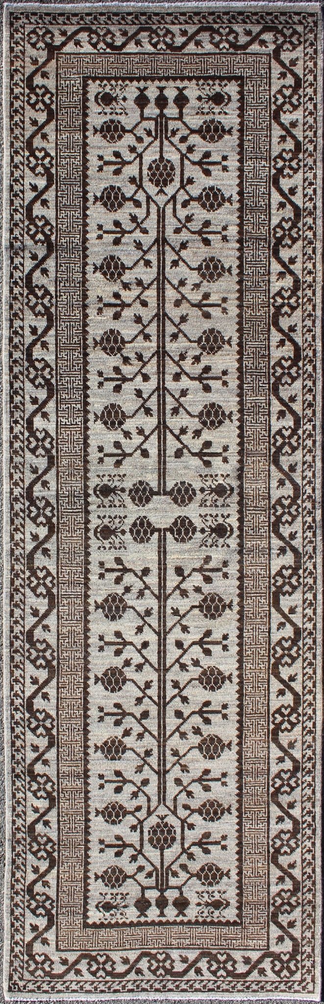 Rug with Geometric Medallions Khotan with Geometric rug MP - 1404 - 909, country of origin / type: Afghanistan / Khotan This Reproduction Khotan features a geometric multi - medallion pomegranate design flanked by a repeating pattern in the field.... - Keivan Woven ArtsMP - 1404 - 909 - 5367Rug