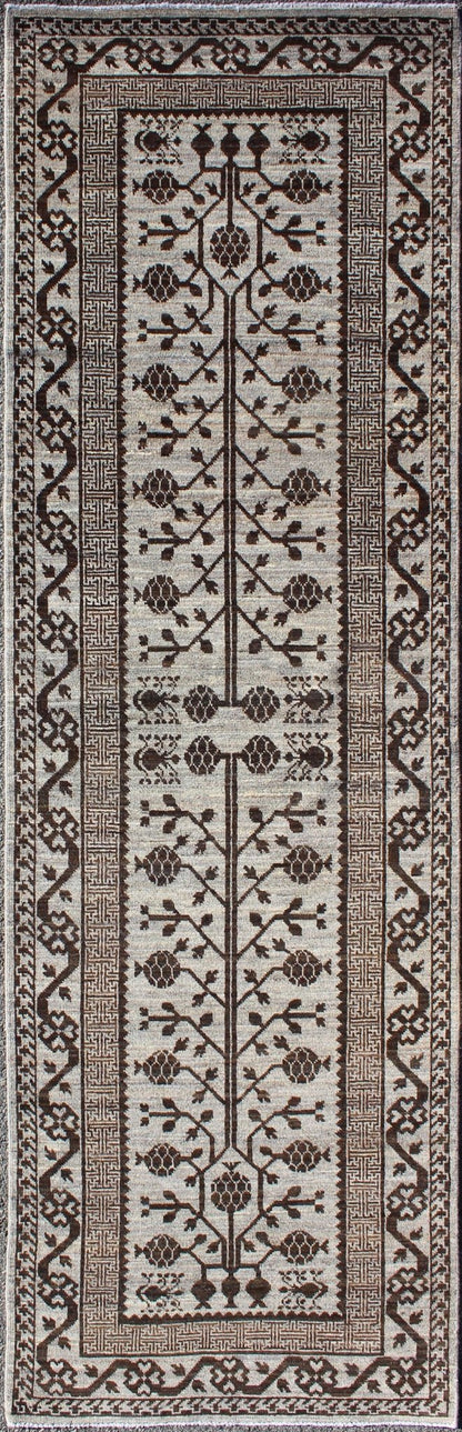 Rug with Geometric Medallions Khotan with Geometric rug MP - 1404 - 909, country of origin / type: Afghanistan / Khotan This Reproduction Khotan features a geometric multi - medallion pomegranate design flanked by a repeating pattern in the field.... - Keivan Woven ArtsMP - 1404 - 909 - 5367Rug