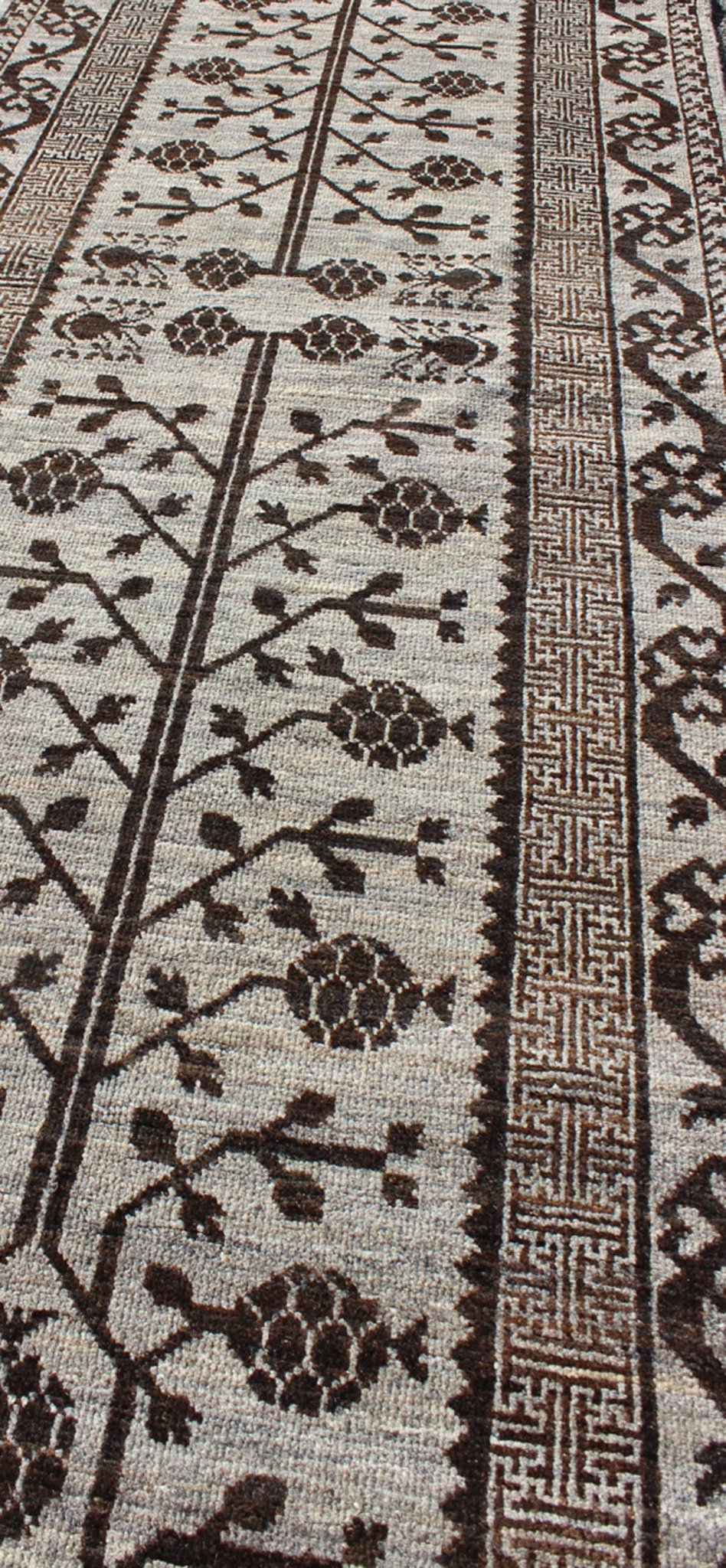 Rug with Geometric Medallions Khotan with Geometric rug MP - 1404 - 909, country of origin / type: Afghanistan / Khotan This Reproduction Khotan features a geometric multi - medallion pomegranate design flanked by a repeating pattern in the field.... - Keivan Woven ArtsMP - 1404 - 909 - 5367Rug