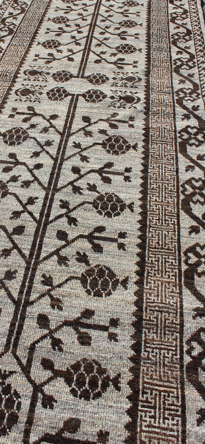 Rug with Geometric Medallions Khotan with Geometric rug MP - 1404 - 909, country of origin / type: Afghanistan / Khotan This Reproduction Khotan features a geometric multi - medallion pomegranate design flanked by a repeating pattern in the field.... - Keivan Woven ArtsMP - 1404 - 909 - 5367Rug