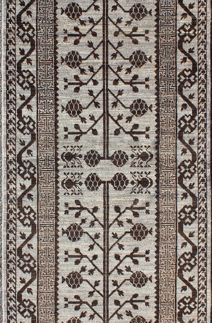 Rug with Geometric Medallions Khotan with Geometric rug MP - 1404 - 909, country of origin / type: Afghanistan / Khotan This Reproduction Khotan features a geometric multi - medallion pomegranate design flanked by a repeating pattern in the field.... - Keivan Woven ArtsMP - 1404 - 909 - 5367Rug