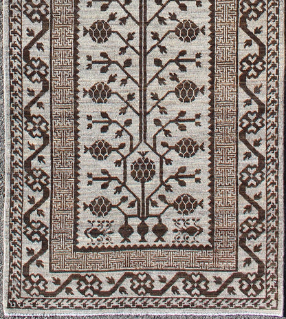 Rug with Geometric Medallions Khotan with Geometric rug MP - 1404 - 909, country of origin / type: Afghanistan / Khotan This Reproduction Khotan features a geometric multi - medallion pomegranate design flanked by a repeating pattern in the field.... - Keivan Woven ArtsMP - 1404 - 909 - 5367Rug