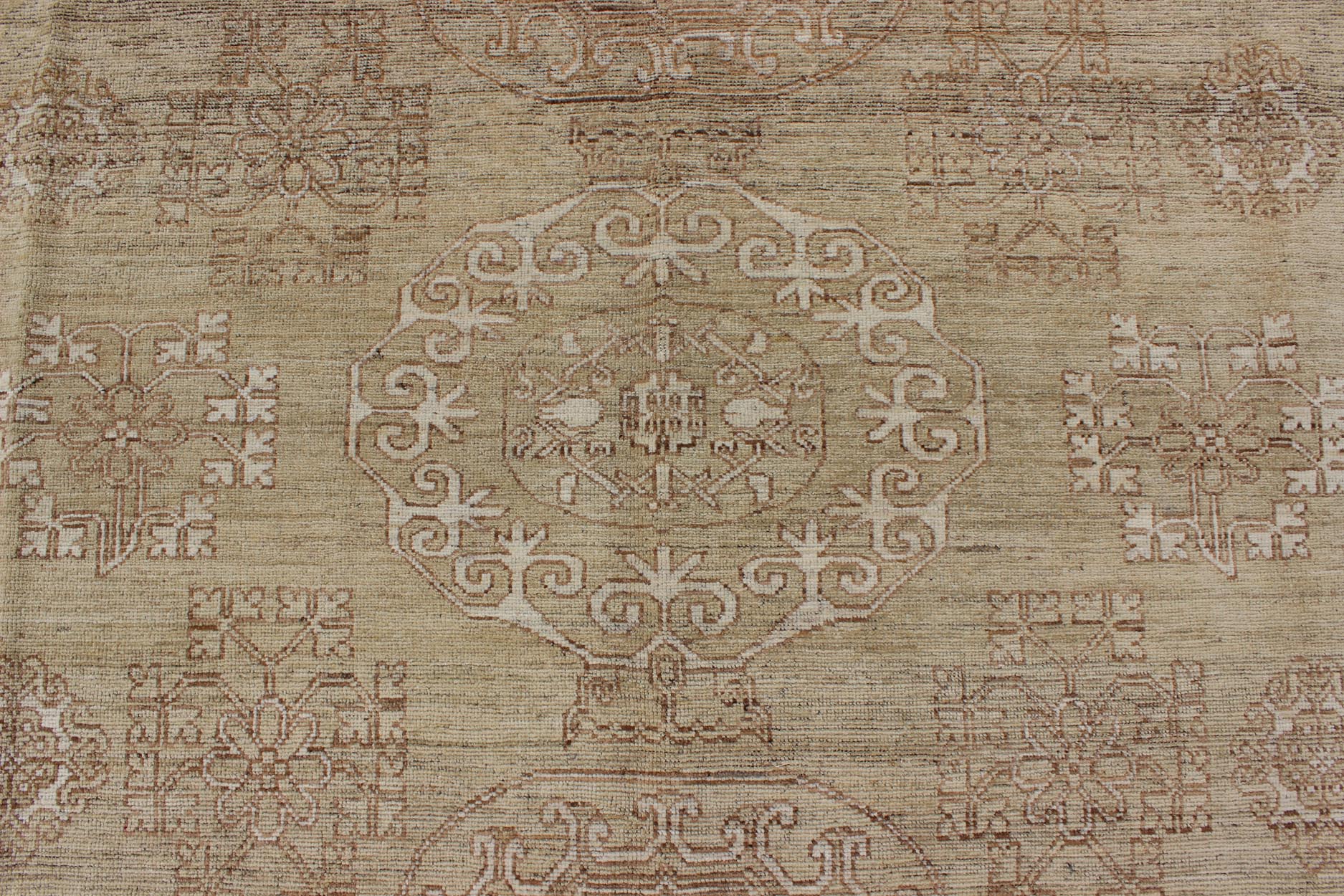 Khotan Design Rug with All - Over Geometric Pattern in Light Brown and Green's. Keivan Woven Arts / rug MP - 1409 - 1446 country of origin / type: Afghanistan / Khotan. Measures: 8'6 x 10'4 This Khotan features a geometric all - over design flanked by a ... - Keivan Woven ArtsMP - 1409 - 1446 - 5924Rug