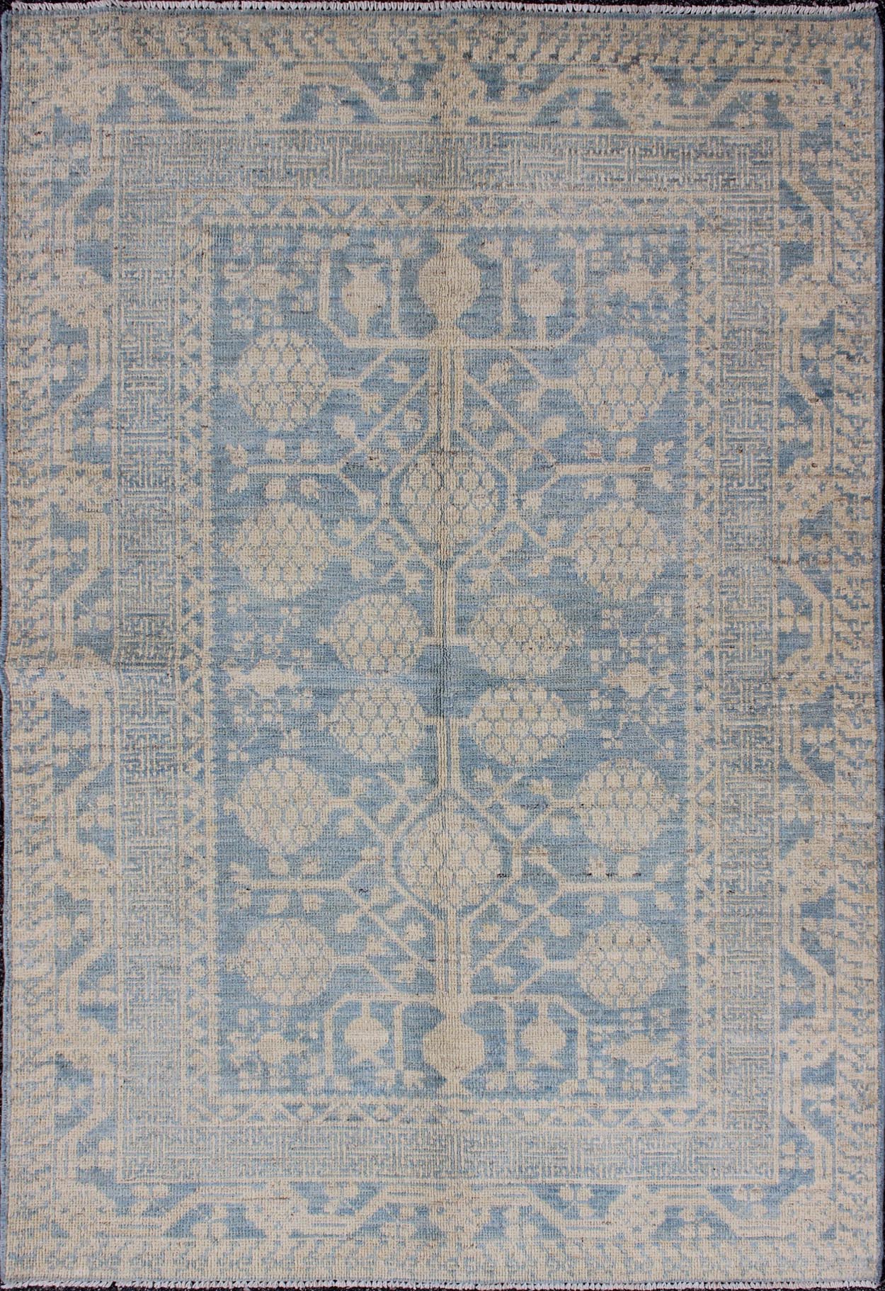 Pomegranate Design Modern Khotan Rug in Light Blue and Cream MP - 1503 - 3571 country of origin / type: Afghanistan / Khotan This Reproduction Khotan features a geometric pomegranate design flanked by a repeating pattern in the border. The entirety ... - Keivan Woven ArtsMP - 1503 - 3571 - 6436Rug
