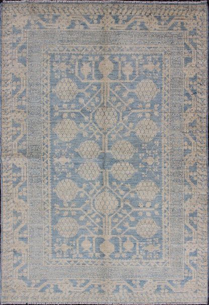 Pomegranate Design Modern Khotan Rug in Light Blue and Cream MP - 1503 - 3571 country of origin / type: Afghanistan / Khotan This Reproduction Khotan features a geometric pomegranate design flanked by a repeating pattern in the border. The entirety ... - Keivan Woven ArtsMP - 1503 - 3571 - 6436Rug