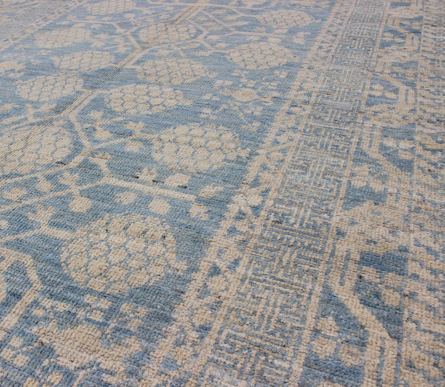 Pomegranate Design Modern Khotan Rug in Light Blue and Cream MP - 1503 - 3571 country of origin / type: Afghanistan / Khotan This Reproduction Khotan features a geometric pomegranate design flanked by a repeating pattern in the border. The entirety ... - Keivan Woven ArtsMP - 1503 - 3571 - 6436Rug