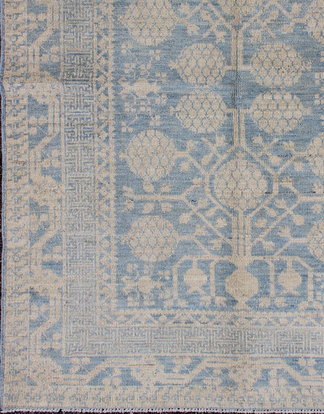 Pomegranate Design Modern Khotan Rug in Light Blue and Cream MP - 1503 - 3571 country of origin / type: Afghanistan / Khotan This Reproduction Khotan features a geometric pomegranate design flanked by a repeating pattern in the border. The entirety ... - Keivan Woven ArtsMP - 1503 - 3571 - 6436Rug