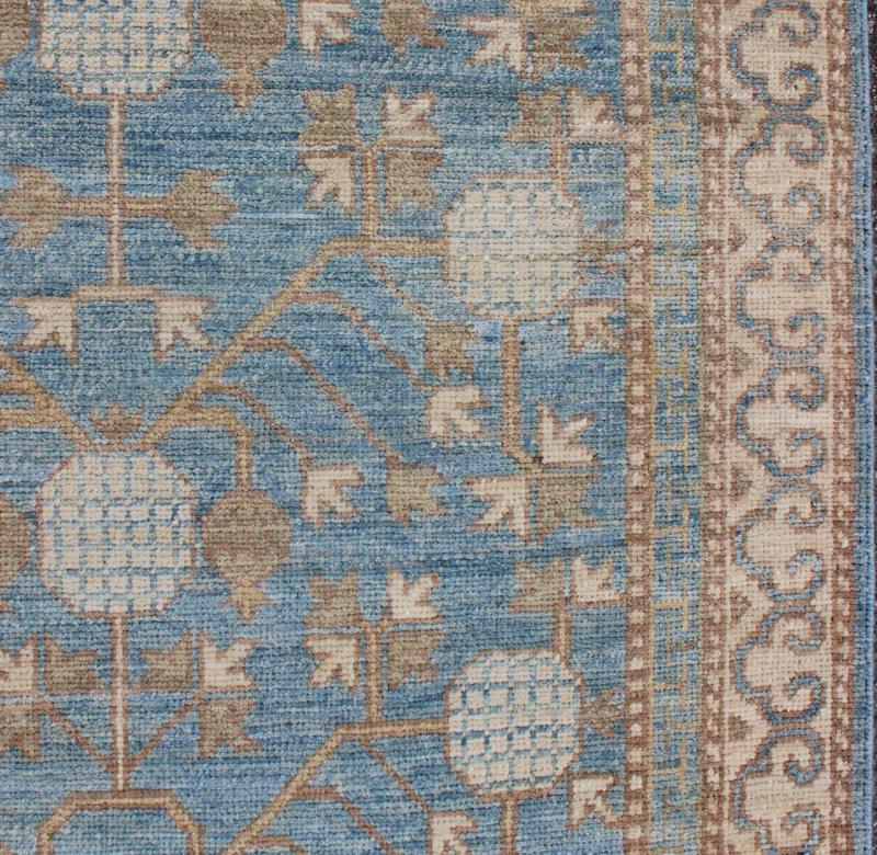 Rug with Pomegranate Design Khotan MP - 1504 - 1353 country of origin / type: Afghanistan / Khotan This Reproduction Khotan features a geometric pomegranate design flanked by a repeating pattern in the border. The entirety of the piece is rendered i... - Keivan Woven ArtsMP - 1504 - 1353 - 6442Rug