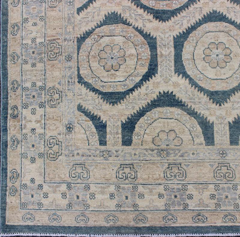 Khotan Design Rug With Geometric Medallions in Tan, Blue Gray & Teal Blue Rug with All - over Khotan Design with Geometric Motifs MP - 1504 - 3391, country of origin / type: Afghanistan / Khotan This Reproduction Khotan features a geometric al... - Keivan Woven ArtsMP - 1504 - 3391 - 6450Rug