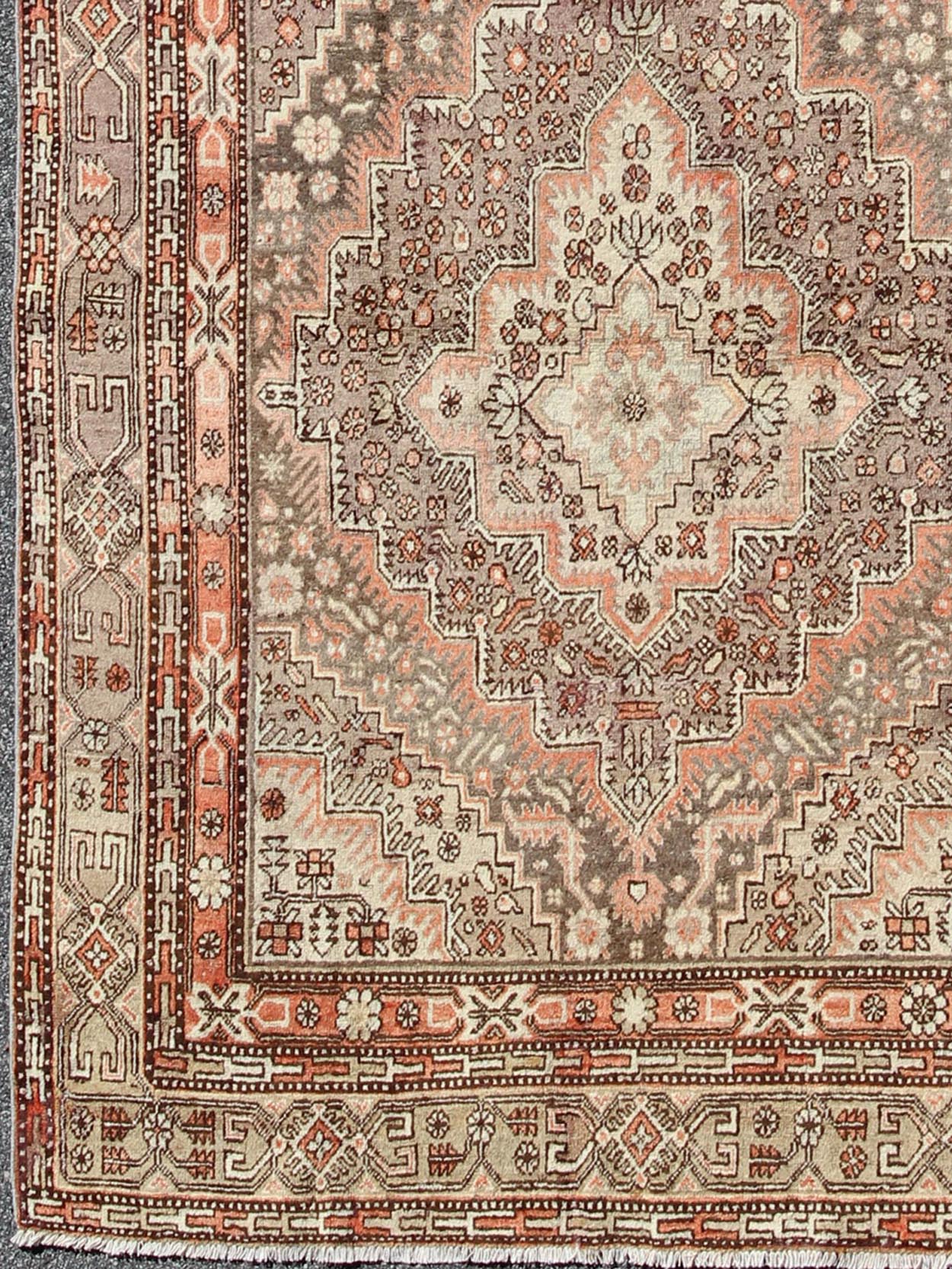 Khotan Gallery Rug This beautiful Khotan rug from East Turkestan has a wonderful, light purple border that imbues it with an Asian aesthetic. The border is encased by two guard borders, featuring a multicolored Greek key design. The field has tw... - Keivan Woven ArtsMP - 1610 - 157264 - 7865Rug