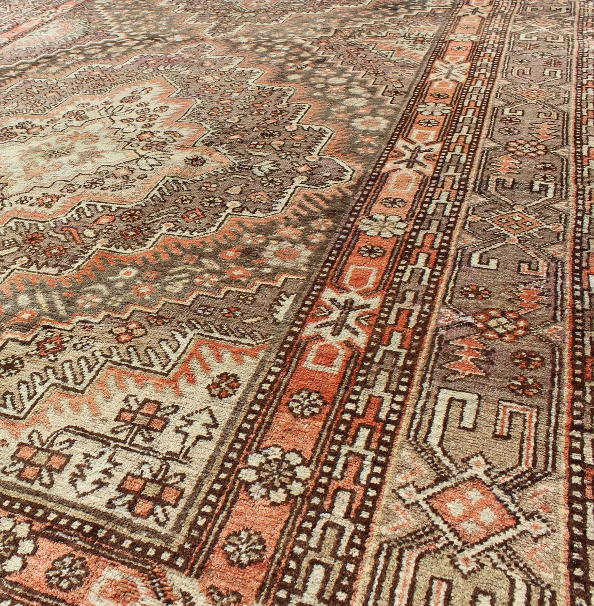 Khotan Gallery Rug This beautiful Khotan rug from East Turkestan has a wonderful, light purple border that imbues it with an Asian aesthetic. The border is encased by two guard borders, featuring a multicolored Greek key design. The field has tw... - Keivan Woven ArtsMP - 1610 - 157264 - 7865Rug