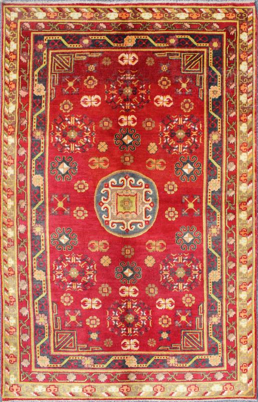 Red Antique Khotan Rug in Rich Red, Charcoal and green colors This attractive vintage Khotan rug is a spectacular testament to the complexity of Turkestan design. The red of the central field plays host to a stunning display of the entwined tree... - Keivan Woven ArtsMP - 1610 - 157285 - 7873Rug