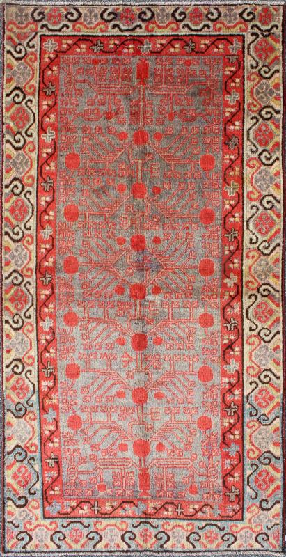 Intricate Vintage Khotan Rug with Sub - Geometric Design in Reds and Light Blue. Measures: 3'10'' x 8'1''. This unique antique Khotan rug is a spectacular testament to the complexity of Turkestan design. The red and light blue of the central fi... - Keivan Woven ArtsMP - 1610 - 157641 - 7877Rug