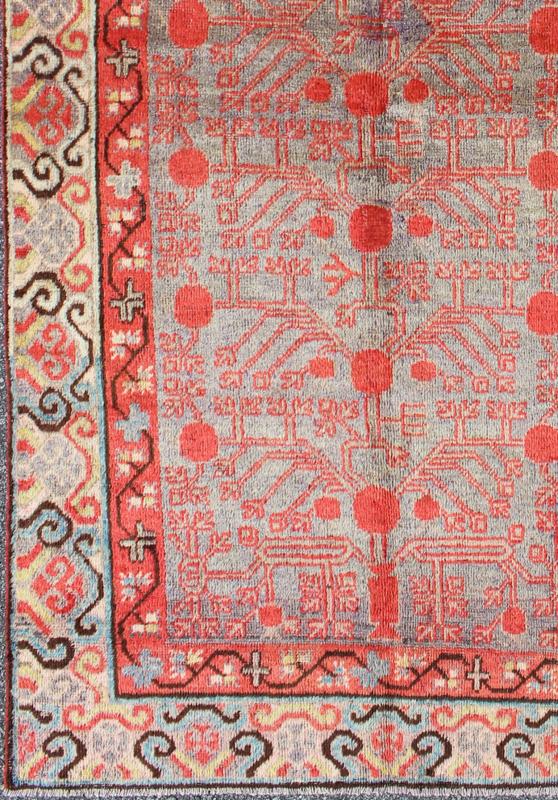 Intricate Vintage Khotan Rug with Sub - Geometric Design in Reds and Light Blue. Measures: 3'10'' x 8'1''. This unique antique Khotan rug is a spectacular testament to the complexity of Turkestan design. The red and light blue of the central fi... - Keivan Woven ArtsMP - 1610 - 157641 - 7877Rug