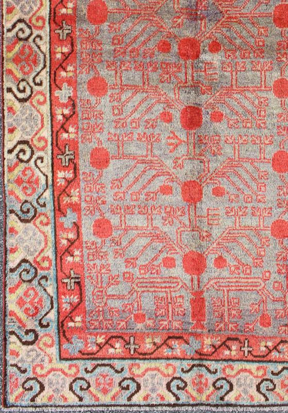 Intricate Vintage Khotan Rug with Sub - Geometric Design in Reds and Light Blue. Measures: 3'10'' x 8'1''. This unique antique Khotan rug is a spectacular testament to the complexity of Turkestan design. The red and light blue of the central fi... - Keivan Woven ArtsMP - 1610 - 157641 - 7877Rug