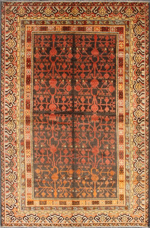 Antique Khotan Rug An antique, early 20th century, Central Asian Khotan rug with traditional all - over pomegranate pattern on a charcoal field surrounded by multiple complementary floral borders of gold and orange. Measures: 5'7 x 8'11. - Keivan Woven ArtsMP - 1610 - 157652 - 7881Rug