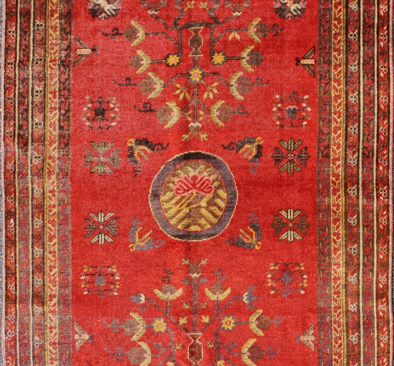 Vibrant Khotan Rug in Red with All - Over Sub - Geometric Floral Design. Measures: 4'1'' x 8'6''. This attractive antique Khotan rug is a spectacular testament to the complexity of Turkestan design. The red of the central field plays host to a st... - Keivan Woven ArtsMP - 1610 - 157698 - 7885Rug