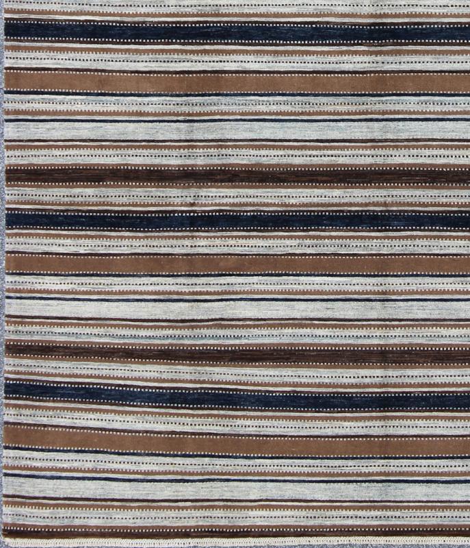 Keivan Woven Arts Fine Gabeh Rug in Stripe Design. Keivan Woven Arts rug/MP - 1703 - 1290, country of origin / type: Afghanistan Measures: 9'0 x 11'6 Made with traditions of Gabbeh from southern Iran, This finely woven rug displays a... - Keivan Woven ArtsMP - 1703 - 1290 - 8263Rug