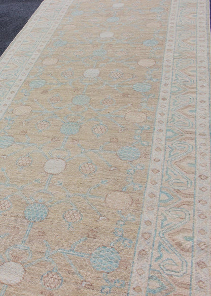 Pomegranate Khotan Design Long Runner in Soft Gold & L. Blue & Geometric Border. Long Khotan runner in Pomegranate Khotan Design, rug MP - 1910 - 10524, country of origin / type: Afghanistan / Khotan This Khotan features a geometric all - over Pom... - Keivan Woven ArtsMP - 1910 - 10524 - 12222Rug