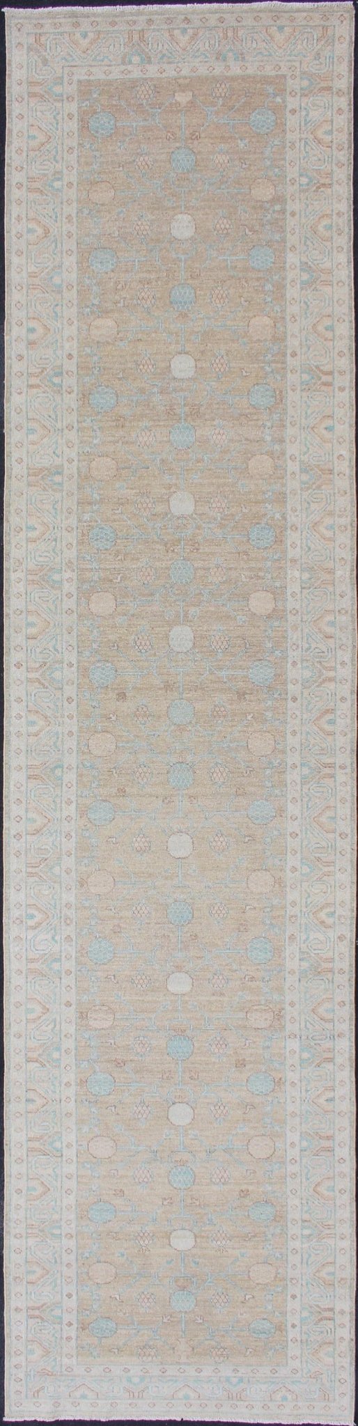 Pomegranate Khotan Design Long Runner in Soft Gold & L. Blue & Geometric Border. Long Khotan runner in Pomegranate Khotan Design, rug MP - 1910 - 10524, country of origin / type: Afghanistan / Khotan This Khotan features a geometric all - over Pom... - Keivan Woven ArtsMP - 1910 - 10524 - 12222Rug