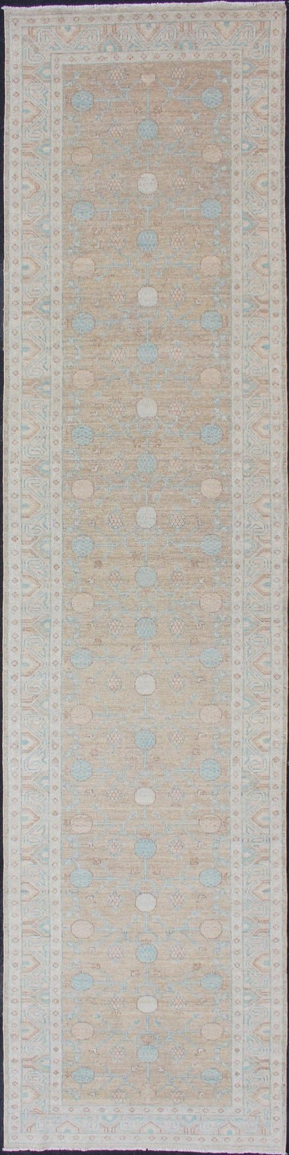 Pomegranate Khotan Design Long Runner in Soft Gold & L. Blue & Geometric Border. Long Khotan runner in Pomegranate Khotan Design, rug MP - 1910 - 10524, country of origin / type: Afghanistan / Khotan This Khotan features a geometric all - over Pom... - Keivan Woven ArtsMP - 1910 - 10524 - 12222Rug