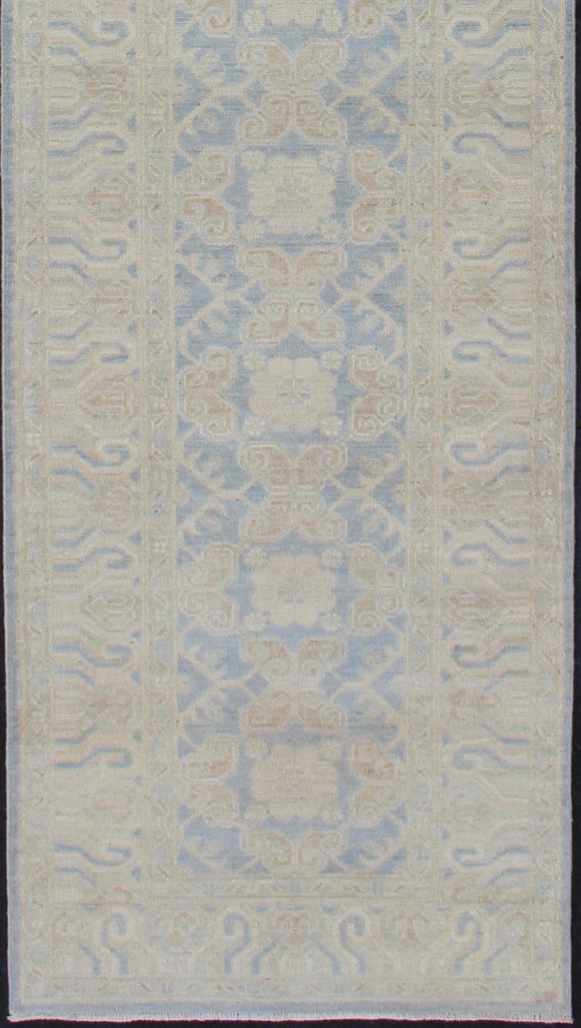 Afghan Khotan Runner with Geometric Design in Shades of Powder Blue and Tan Keivan Woven Arts / rug MP - 1911 - 10727, country of origin / type: Afghanistan / Khotan This Reproduction Khotan features a geometric all - over design flanked by a repeatin... - Keivan Woven ArtsMP - 1911 - 10727 - 12301Rug