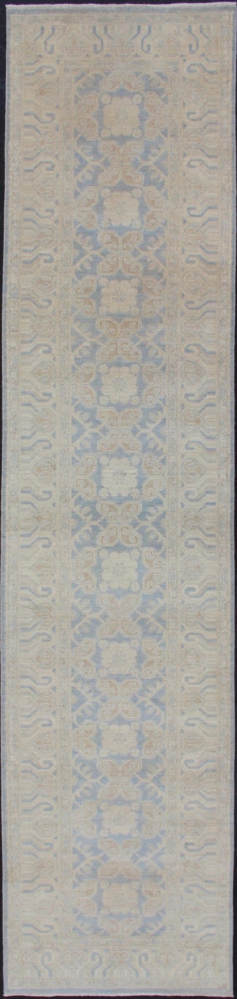 Afghan Khotan Runner with Geometric Design in Shades of Powder Blue and Tan Keivan Woven Arts / rug MP - 1911 - 10727, country of origin / type: Afghanistan / Khotan This Reproduction Khotan features a geometric all - over design flanked by a repeatin... - Keivan Woven ArtsMP - 1911 - 10727 - 12301Rug