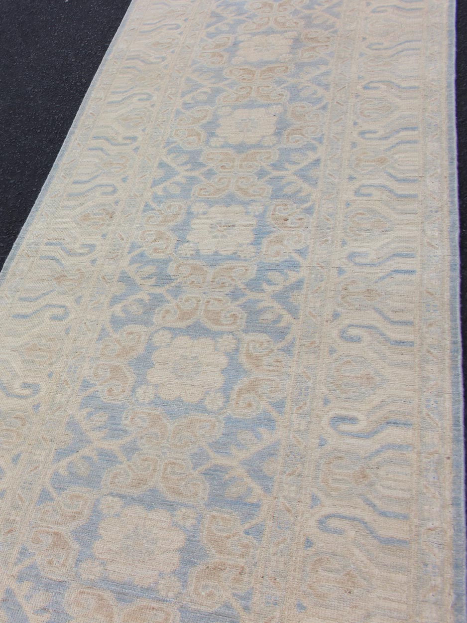 Afghan Khotan Runner with Geometric Design in Shades of Powder Blue and Tan Keivan Woven Arts / rug MP - 1911 - 10727, country of origin / type: Afghanistan / Khotan This Reproduction Khotan features a geometric all - over design flanked by a repeatin... - Keivan Woven ArtsMP - 1911 - 10727 - 12301