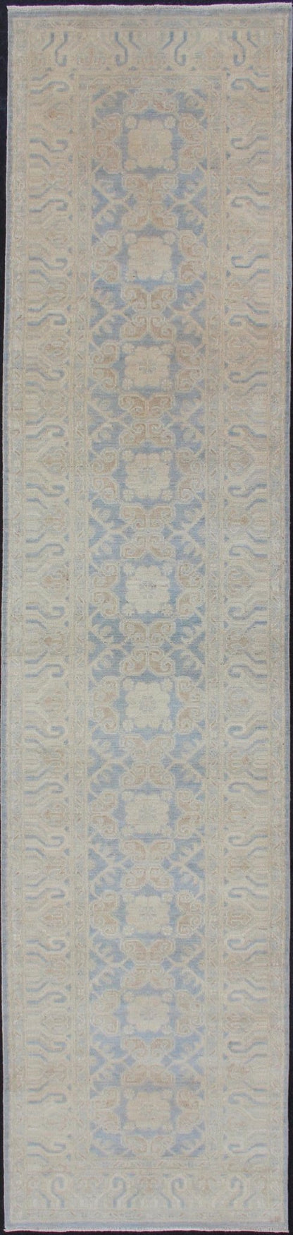 Afghan Khotan Runner with Geometric Design in Shades of Powder Blue and Tan Keivan Woven Arts / rug MP - 1911 - 10727, country of origin / type: Afghanistan / Khotan This Reproduction Khotan features a geometric all - over design flanked by a repeatin... - Keivan Woven ArtsMP - 1911 - 10727 - 12301
