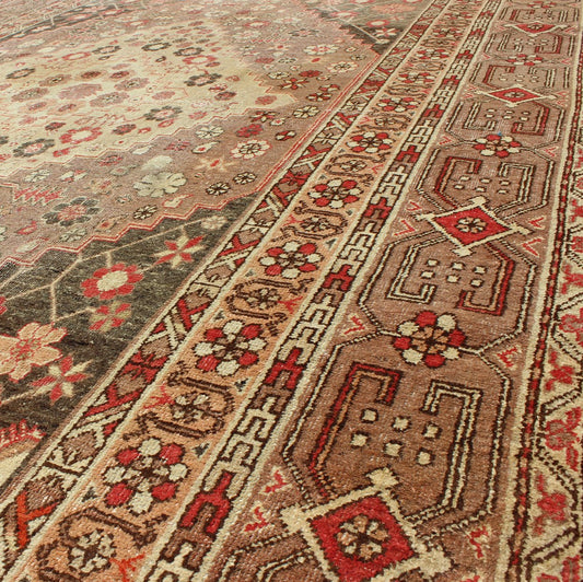 Antique Khotan Medallion Rug in Neutrals and Blush with Floral Motifs All - Over Measures: 6'4 x 11'6 This beautiful Khotan rug, from early 20th century Turkestan features layered medallions in geometric and diamond shapes. The field and ... - Keivan Woven ArtsMP - 252 - 2125