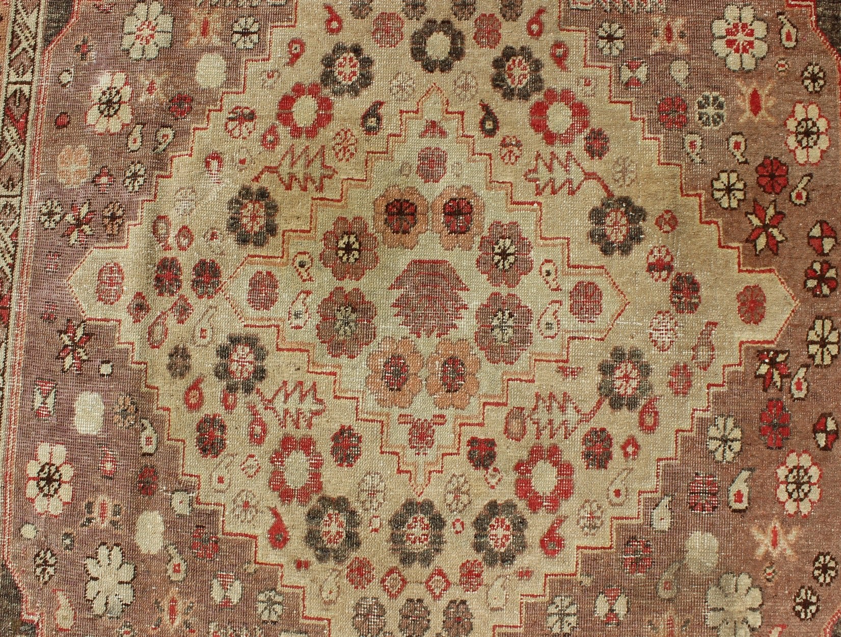 Antique Khotan Medallion Rug in Neutrals and Blush with Floral Motifs All - Over Measures: 6'4 x 11'6 This beautiful Khotan rug, from early 20th century Turkestan features layered medallions in geometric and diamond shapes. The field and ... - Keivan Woven ArtsMP - 252 - 2125Rug