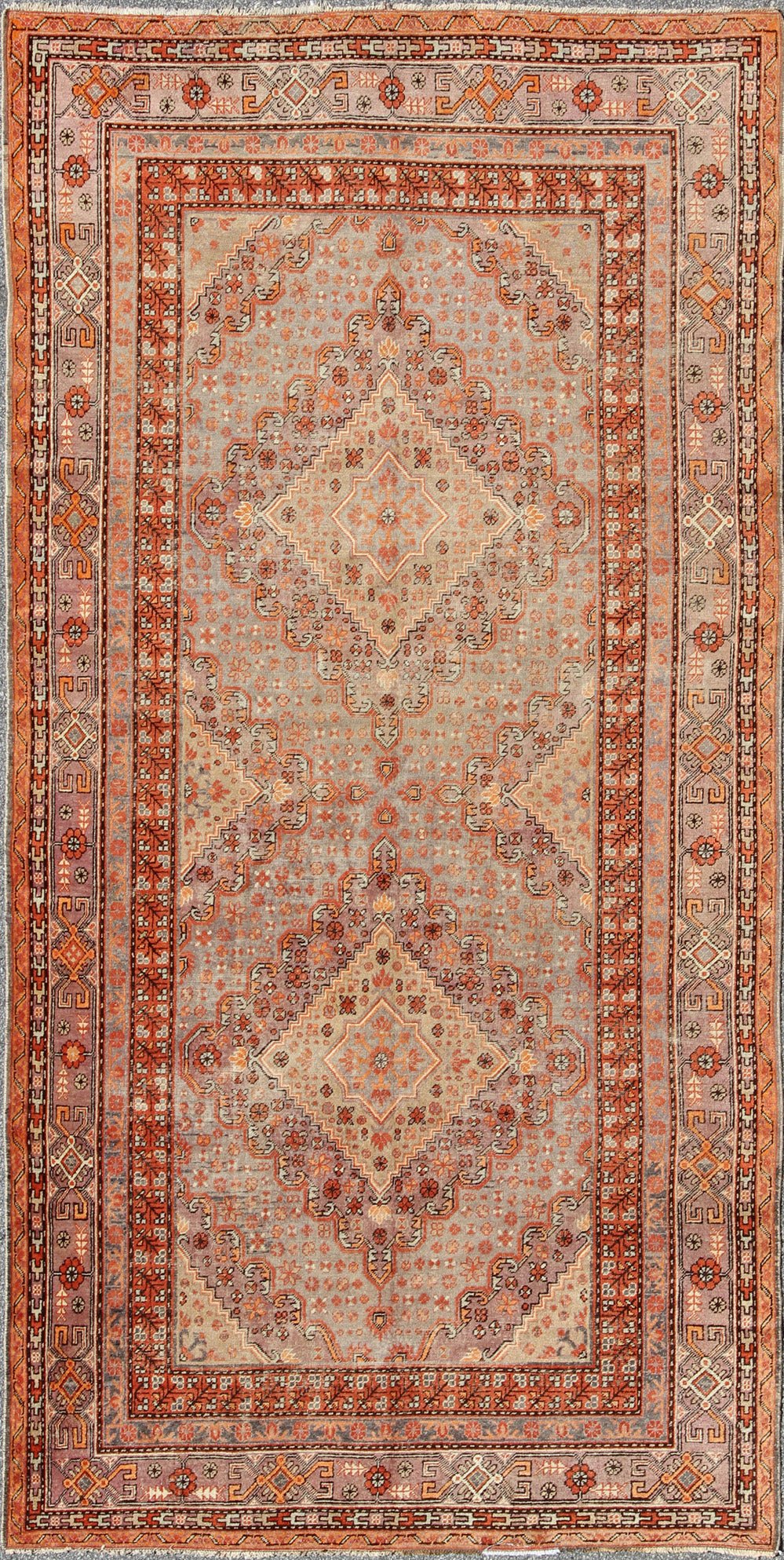 Antique Khotan Rug This delicately rendered antique Khotan rug was handcrafted in Turkestan during the early part of 20th century and displays an intricate Sub - geometric design with paired, diamond - shaped medallions. Measures: 6'5 x 13'. - Keivan Woven ArtsMP - 749 - 1927Rug