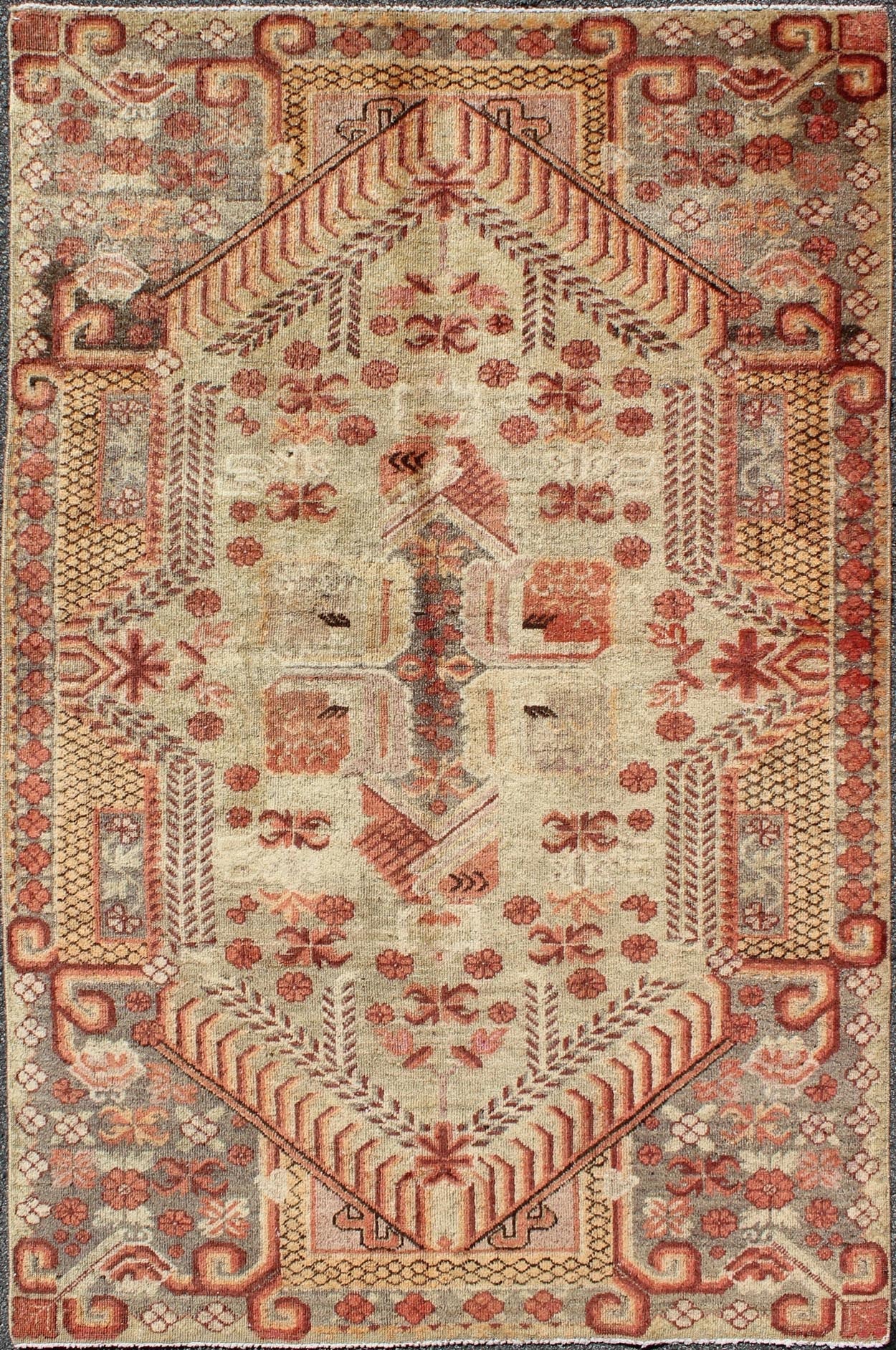 Antique Khotan Rug with Unique Pattern in Gray Border, soft Yellow Green field, Red, Red Orange, Lt. Green & Brown. Khotan Antique Rug with Exquisite Tribal Patterns in Gray, Light blue, Orange, Lt. Green, Orange, Sand, Taupe. Keivan Woven Arts... - Keivan Woven ArtsMP - 884 - 113550 - 3025Rug