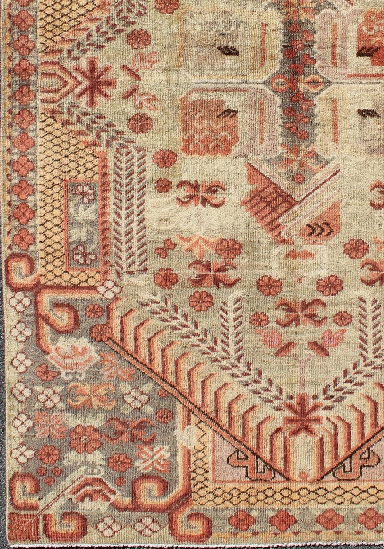 Antique Khotan Rug with Unique Pattern in Gray Border, soft Yellow Green field, Red, Red Orange, Lt. Green & Brown. Khotan Antique Rug with Exquisite Tribal Patterns in Gray, Light blue, Orange, Lt. Green, Orange, Sand, Taupe. Keivan Woven Arts... - Keivan Woven ArtsMP - 884 - 113550 - 3025Rug