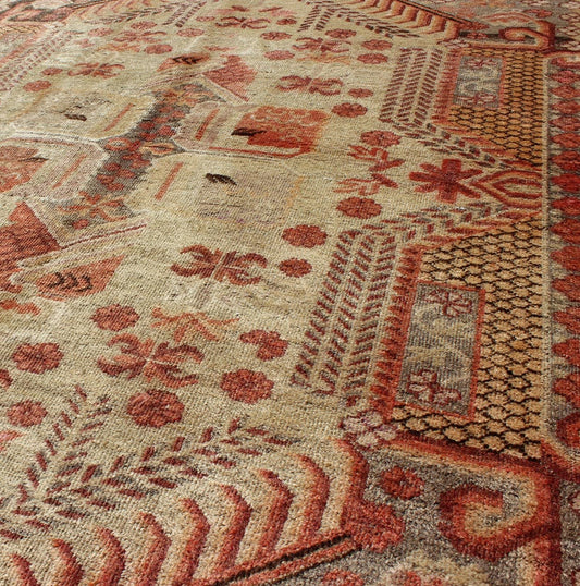 Antique Khotan Rug with Unique Pattern in Gray Border, soft Yellow Green field, Red, Red Orange, Lt. Green & Brown. Khotan Antique Rug with Exquisite Tribal Patterns in Gray, Light blue, Orange, Lt. Green, Orange, Sand, Taupe. Keivan Woven Arts... - Keivan Woven ArtsMP - 884 - 113550 - 3025Rug