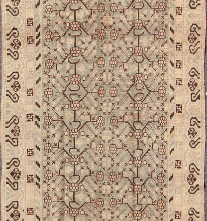 Antique Turkmenistan Khotan Carpet This wonderful Khotan shows the traditional pomegranate design with a unique color combination. The border has a scroll design, with a smaller Greek key guard border. The beautiful colors include a gray - blue ba... - Keivan Woven ArtsMP - 885 - 375 - 3031Rug