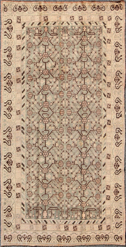 Antique Turkmenistan Khotan Carpet This wonderful Khotan shows the traditional pomegranate design with a unique color combination. The border has a scroll design, with a smaller Greek key guard border. The beautiful colors include a gray - blue ba... - Keivan Woven ArtsMP - 885 - 375 - 3031Rug