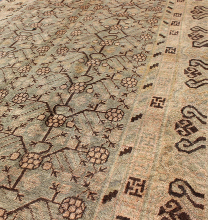 Antique Turkmenistan Khotan Carpet This wonderful Khotan shows the traditional pomegranate design with a unique color combination. The border has a scroll design, with a smaller Greek key guard border. The beautiful colors include a gray - blue ba... - Keivan Woven ArtsMP - 885 - 375 - 3031Rug