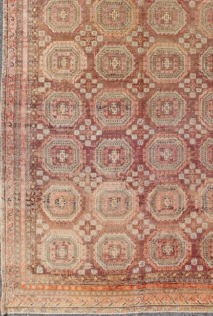 Antique Khotan rug with repeating medallion design in maroon / red, mpc - 538, country of origin / type: Russia / tribal, circa 1900 This piece is a rare antique carpet from Turkestan with delightful colors and all - over repeating medallion design.... - Keivan Woven ArtsMPC - 538 - 8988Rug