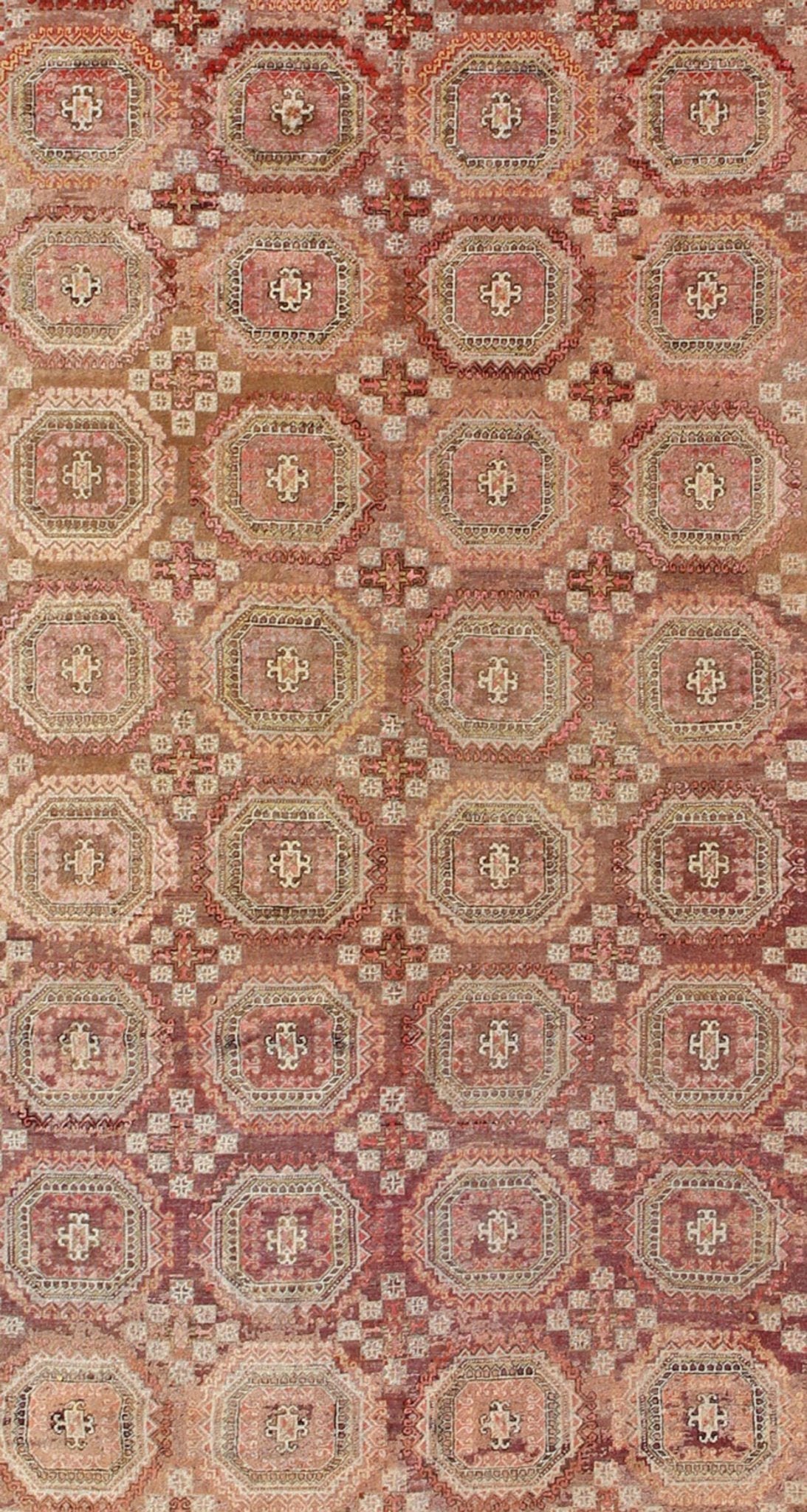 Antique Khotan rug with repeating medallion design in maroon / red, mpc - 538, country of origin / type: Russia / tribal, circa 1900 This piece is a rare antique carpet from Turkestan with delightful colors and all - over repeating medallion design.... - Keivan Woven ArtsMPC - 538 - 8988Rug