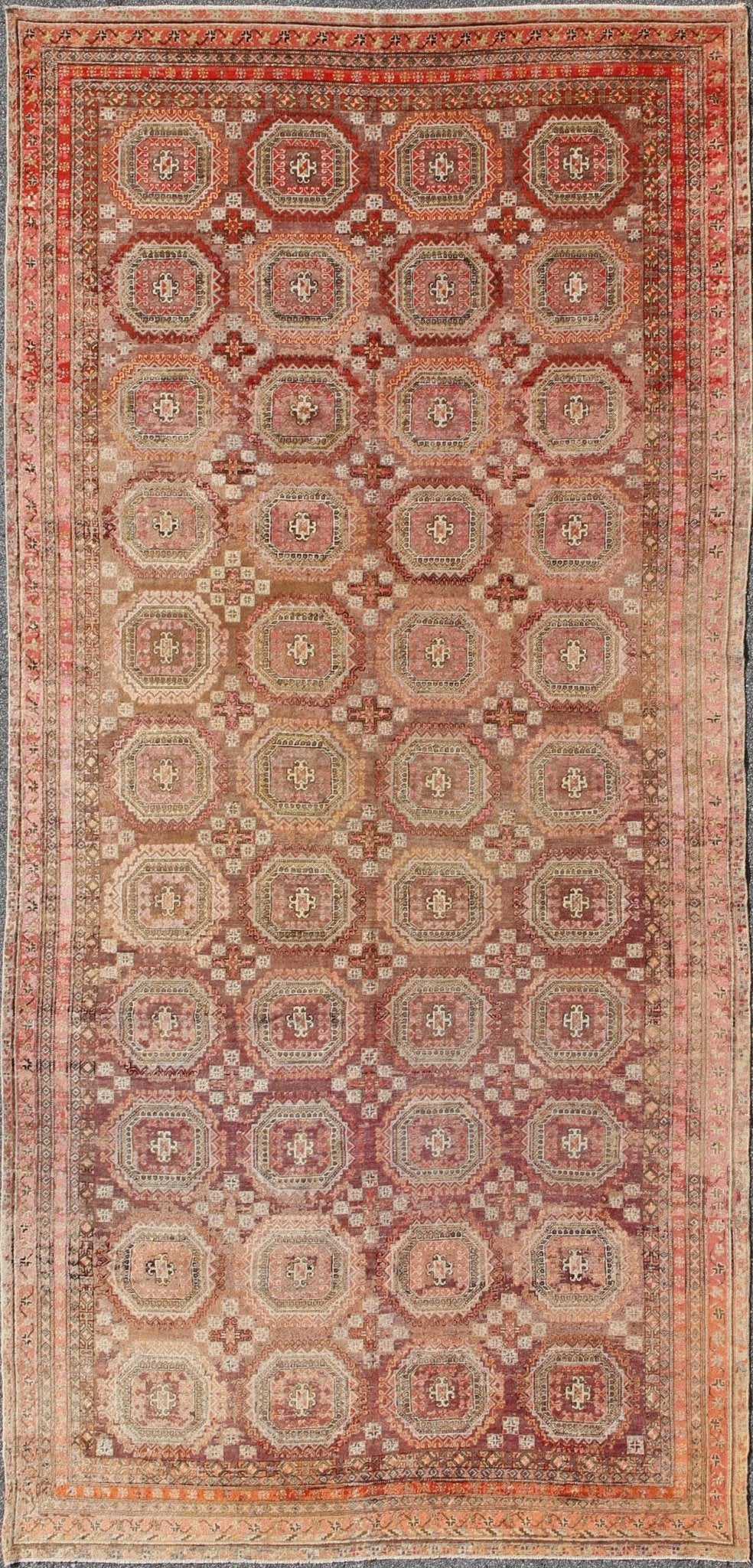 Antique Khotan rug with repeating medallion design in maroon / red, mpc - 538, country of origin / type: Russia / tribal, circa 1900 This piece is a rare antique carpet from Turkestan with delightful colors and all - over repeating medallion design.... - Keivan Woven ArtsMPC - 538 - 8988Rug
