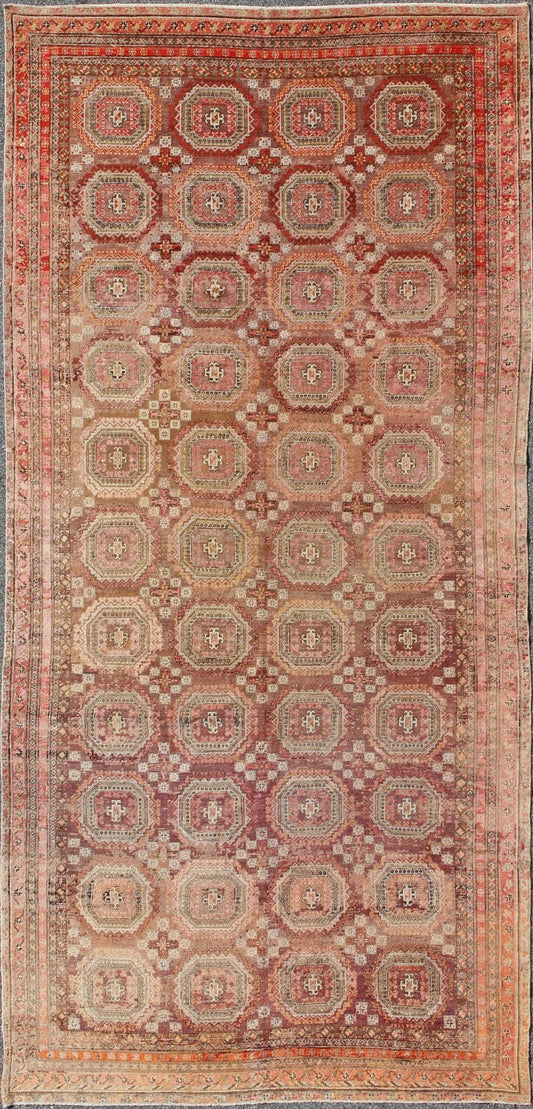 Antique Khotan rug with repeating medallion design in maroon / red, mpc - 538, country of origin / type: Russia / tribal, circa 1900 This piece is a rare antique carpet from Turkestan with delightful colors and all - over repeating medallion design.... - Keivan Woven ArtsMPC - 538 - 8988Rug