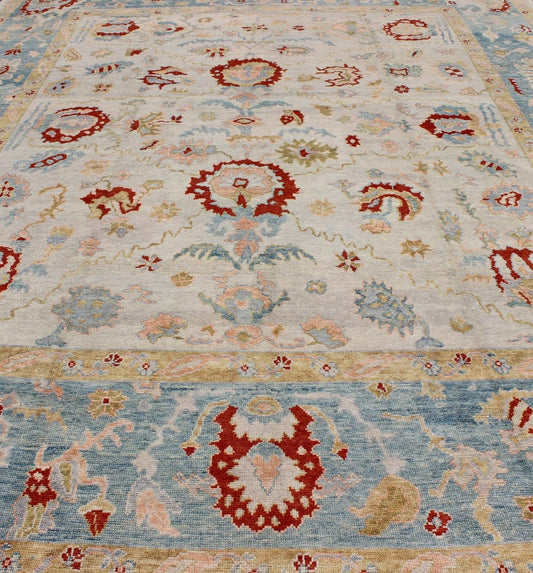 Large Angora Oushak Turkish Rug with All Over Design in Light Blue, Ivory & Red. Large Turkish Oushak rug with array of light colors with a pop of red and medium tones colors and large scale tribal design, rug MSD - 3377, country of origin / type:... - Keivan Woven ArtsMSD - 3377 - 6137Rug